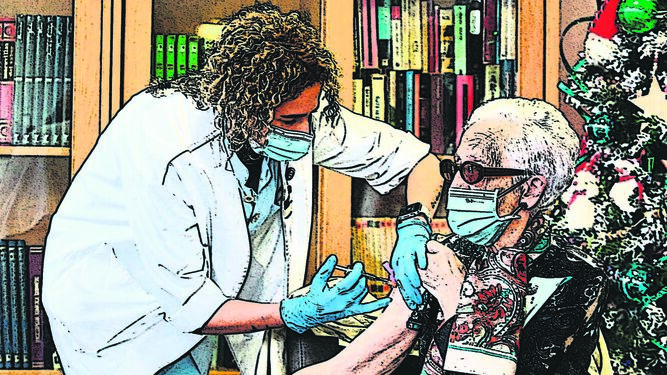 Una sanitaria pone la vacuna de Pfizer a una anciana.