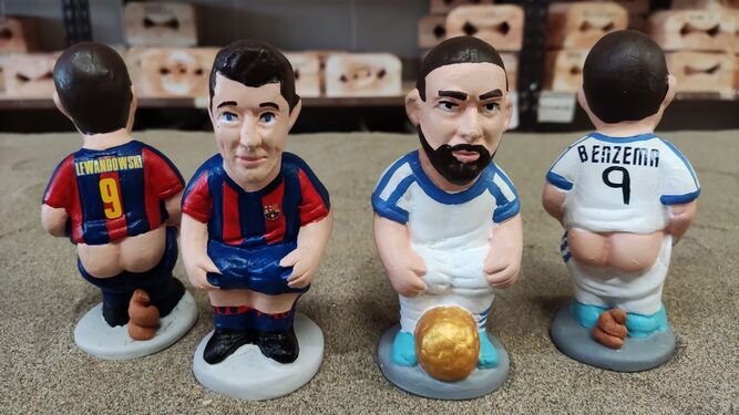 Las figuras de Benzema, con su Balón de Oro, y Lewandowski.